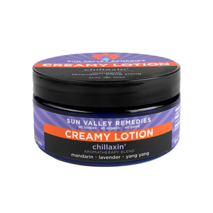 Nine ounce Cobalt jar of Chillaxin' Creamy Lotion. The label indicates the aromatherapy is mandarin, lavender, ylang ylang