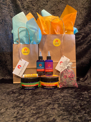 Colorful display of varying sizes of cobalt blue bottles and jars. The labels indicate they are Body Moisturizers with Aloe