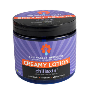 Sixteen ounce Cobalt jar of Chillaxin' Lotion. The label indicates the aromatherapy is mandarin, lavender, and ylang ylang