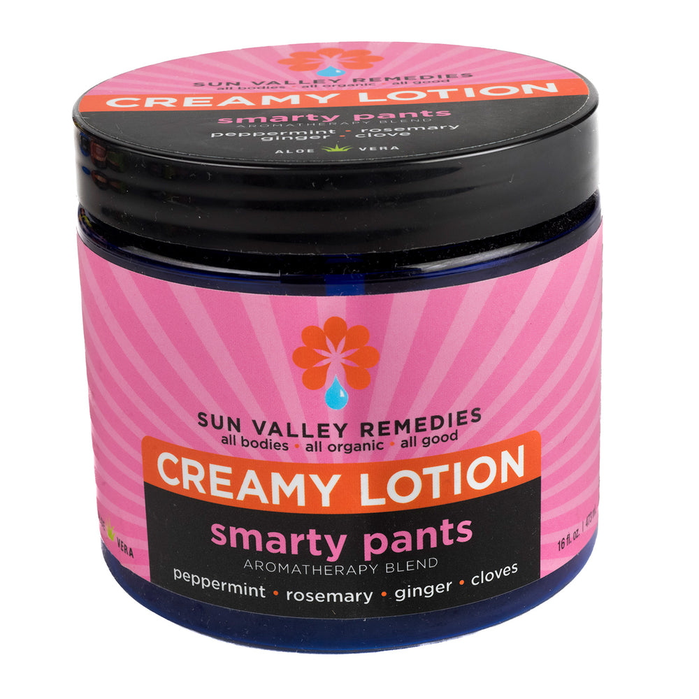 
            
                Load image into Gallery viewer, Sixteen ounce cobalt jar of Smarty Pants lotion. The label indicates the aromatherapy is peppermint, rosemary, ginger, clove
            
        