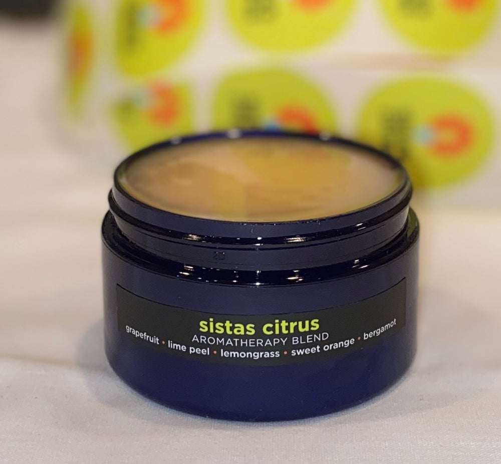 Four ounce cobalt jar of Sistas Citrus Himalayan Salt Scrub with grapefruit, lime peel, lemongrass, sweet orange, bergamot