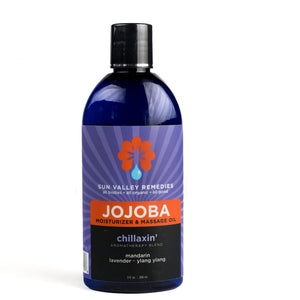 Nine ounce Cobalt bottle of Chillaxin' Jojoba. The label indicates the aromatherapy is mandarin, lavender, and ylang ylang