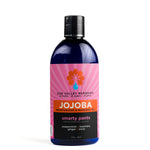 Nine ounce cobalt bottle of Smarty Pants Jojoba oil. The label indicates aromatherapy is peppermint, rosemary, ginger, clove