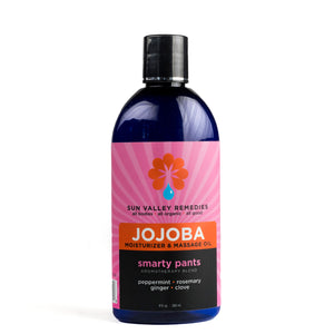 
            
                Load image into Gallery viewer, Nine ounce cobalt bottle of Smarty Pants Jojoba oil. The label indicates aromatherapy is peppermint, rosemary, ginger, clove
            
        