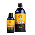 Two cobalt bottles of Beach Baby Jojoba Oil. The yellow label indicates the aromatherapy is plumeria, coconut, and lemongrass