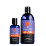 Two cobalt bottles of Chillaxin' Jojoba Oil. The purple label indicates the aromatherapy is mandarin, lavender, and ylang ylang