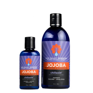 
            
                Load image into Gallery viewer, Two cobalt bottles of Chillaxin&amp;#39; Jojoba Oil. The purple label indicates the aromatherapy is mandarin, lavender, and ylang ylang
            
        
