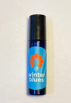 Cobalt blue rollerball filled with Winter Blues aromatherapy blend.